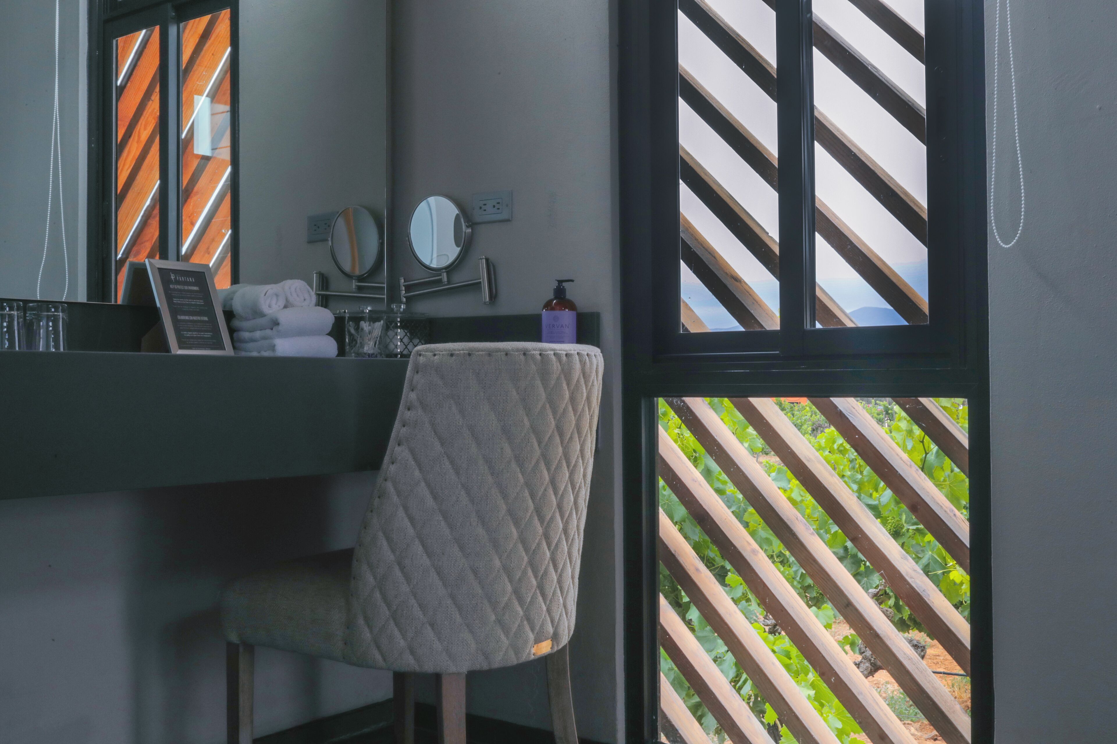 deluxe room | bathroom | shower, slippers, towels