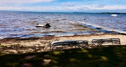 New Listing! Lake front cottage with 100' of private sandy beach