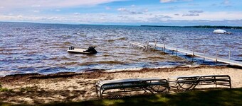 New Listing! Lake front cottage with 100' of private sandy beach