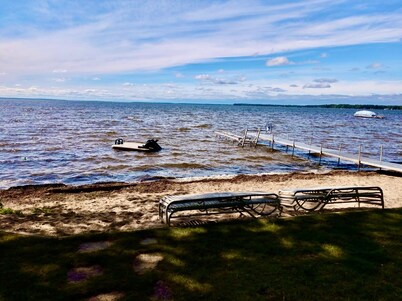New Listing! Lake front cottage with 100' of private sandy beach