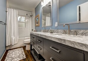 Combined shower/tub, hair dryer, towels, toilet paper