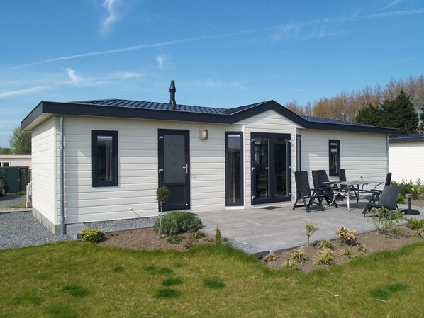 Enjoy a home away from home with a spacious patio and garden, perfect for relaxing.