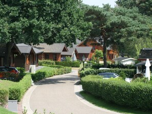 Escape to a tranquil retreat surrounded by nature, with rustic cabins and a serene atmosphere.
