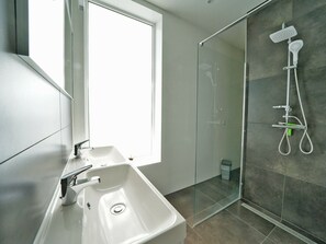 A modern bathroom with a large window, a walk-in shower, and a sink with a mirror. - Modern With Dishwasher, 6km From Elburg (Biddinghuizen)