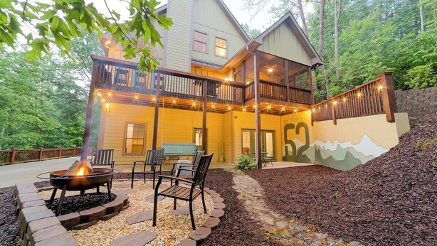 A two-story house with a deck, outdoor seating, and a fire pit. - Retreat 52 - Family retreat / Innsbruck GolfResort (Helen)