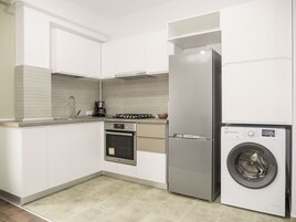 Comfort Apartment | Private kitchen | Full-size fridge, oven, stovetop, dishwasher
