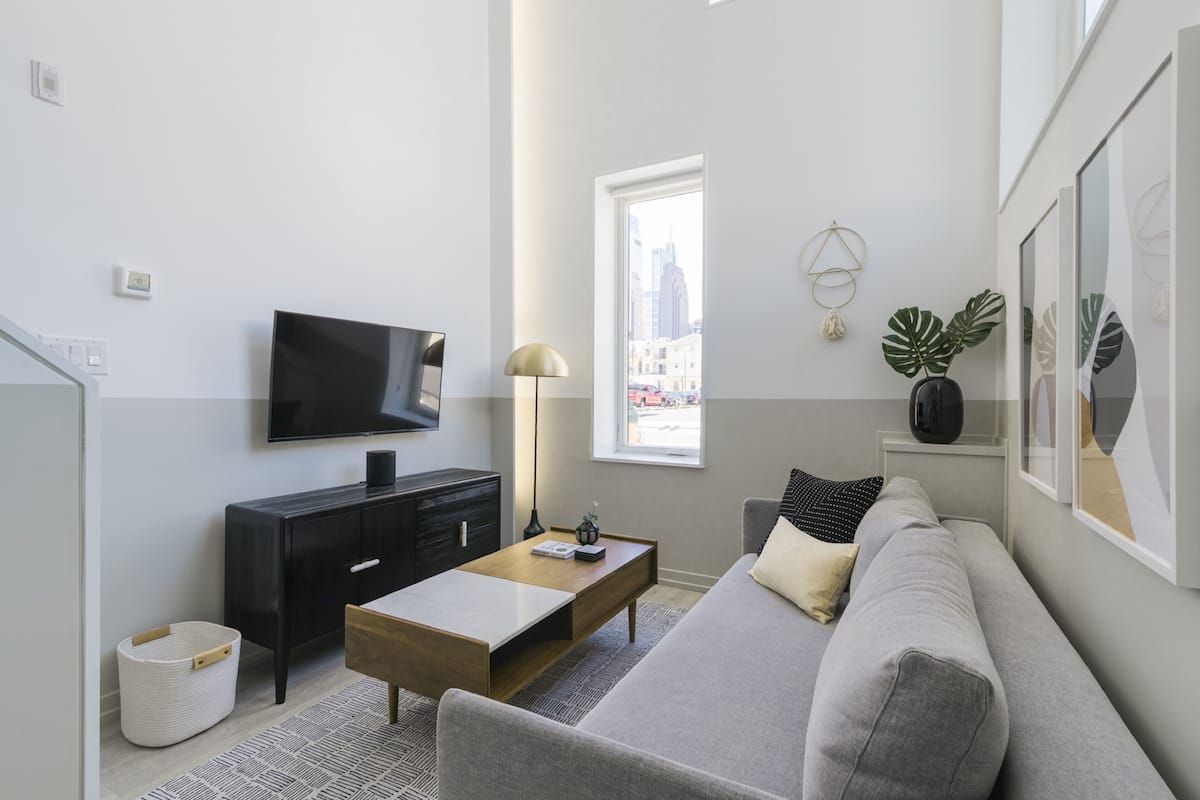 Street-level apartment, Balcony | Living area | 42-inch flat-screen TV with digital channels, TV, smart speakers