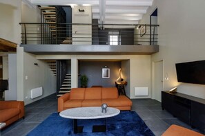 TV, fireplace, books