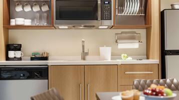 Microwave, coffee/tea maker, dining tables