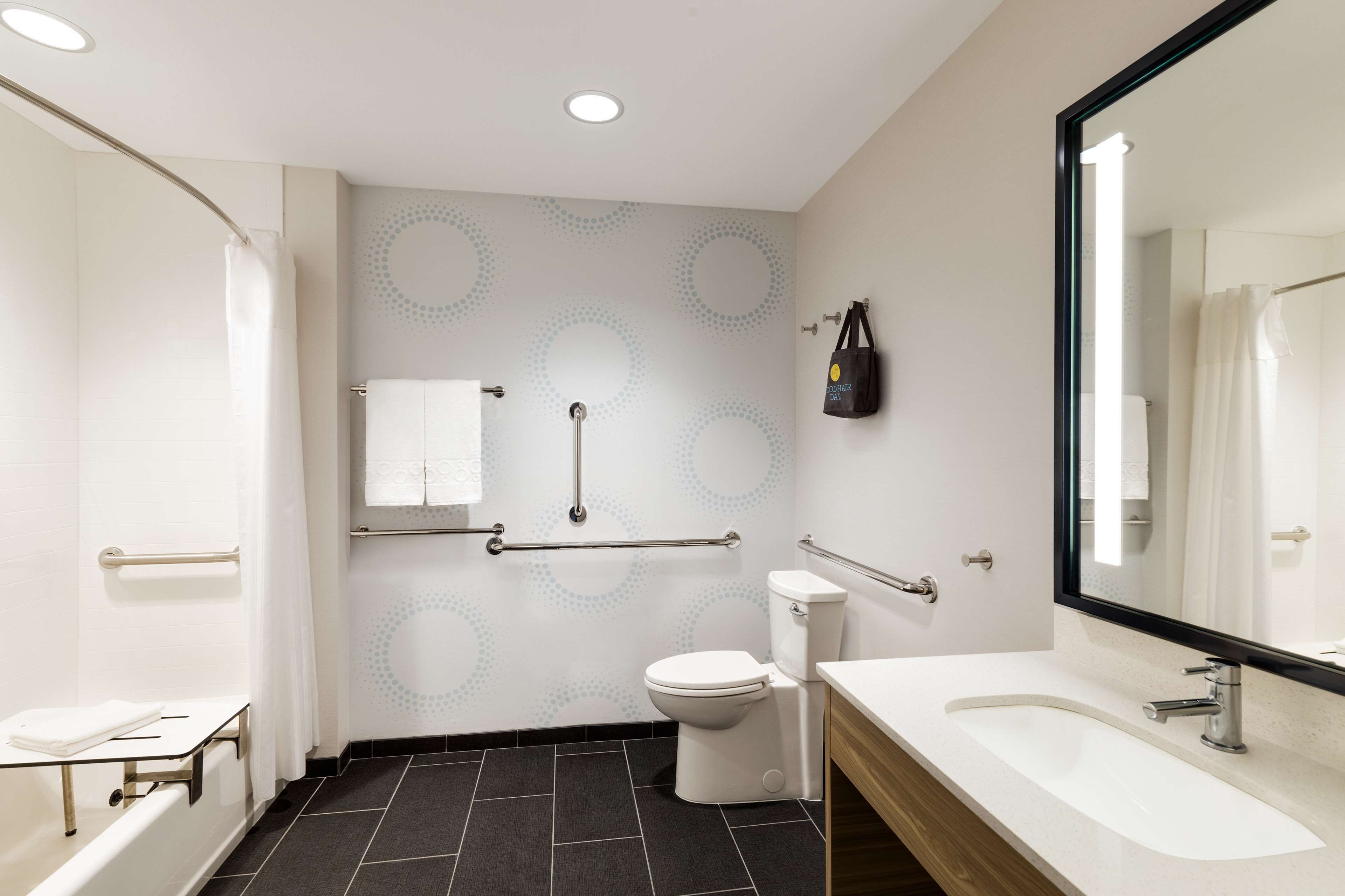 rainfall showerhead, hair dryer, towels, soap