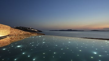 Indoor pool, an infinity pool, free pool cabanas, pool umbrellas