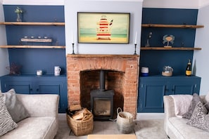 Smart TV, fireplace, DVD player, books