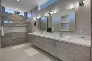 Combined shower/tub, hair dryer, towels, soap
