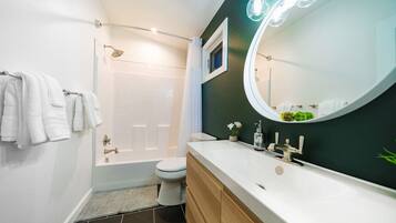 Combined shower/bathtub, hair dryer, towels, soap