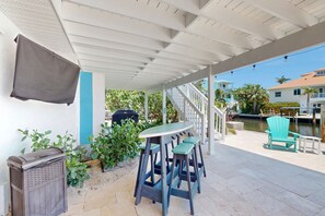 Terrace/patio - Canalfront Island Gem with Private Heated Pool, Dock, Ping-Pong, & Putting Green (Anna Maria)