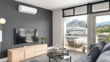 Luxury Apartment, 2 Bedrooms | Living room | 55-inch Smart TV with digital channels, TV, fireplace