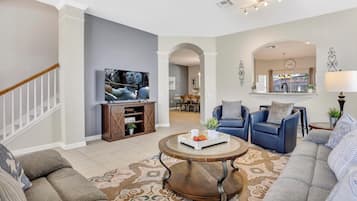 Télévision, table de tennis de table, livres