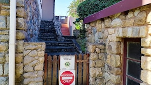 A stone staircase leading to a building with a 'Residents Only' sign and a 'Ramsgate CPF' sign. - All the Tides - Rip Tide (Margate)