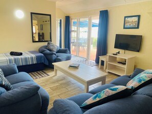 Apartment, 2 Bedrooms | Living area | 32-inch TV with digital channels