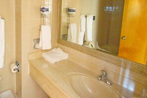 Bathtub, hair dryer, towels, soap