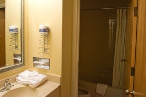 Bathtub, hair dryer, towels, soap