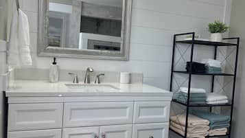 Bathtub, hair dryer, towels, soap