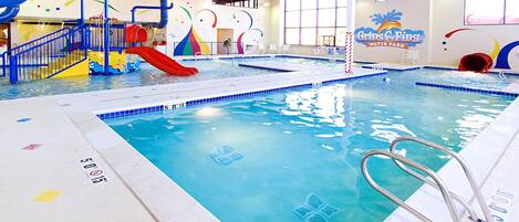 Swimmers can enjoy the pool with depth indicators and a slide for younger guests.
