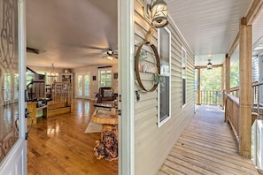Enjoy a warm welcome in this inviting home with a dining area, kitchen, and cozy porch.