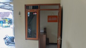 A doorway leading to a room with a sign reading "KOOL KOST". - KoolKost Syariah near Universitas Ahmad Dahlan Kampus 1 (Yogyakarta)