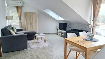 Apartment, Sea View (A) | Living area | 32-inch flat-screen TV with satellite channels, LED TV