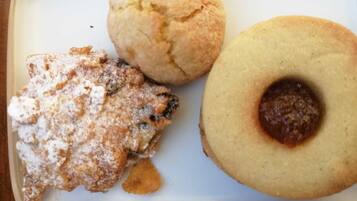 A plate with three different types of pastries.