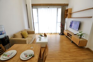 Standard Double Room | Living area | 30-inch flat-screen TV with cable channels, TV, Netflix - Stay Pham Huy Thong Hotel (Hanoi)