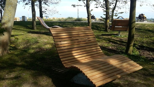 Pure relaxation right by the forest & only 750m to the beach in our retro chalet