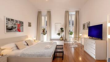Deluxe Apartment, 1 Bedroom | Down comforters, desk, iron/ironing board, free cribs/infant beds