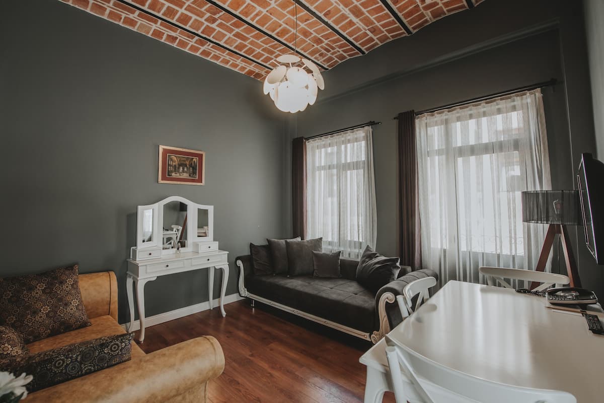 Executive Suite, Balcony | Living room | 32-inch LED TV with cable channels, TV