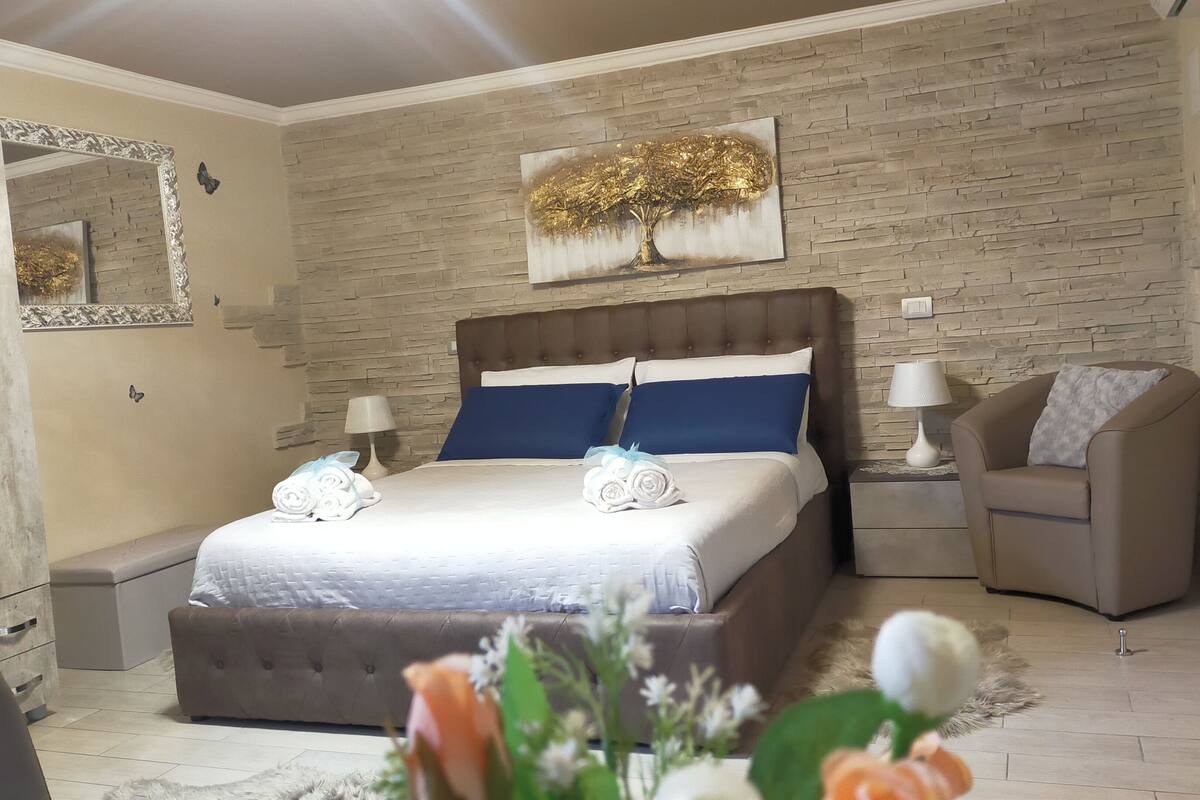 Premium bedding, down duvets, memory-foam beds, laptop workspace
