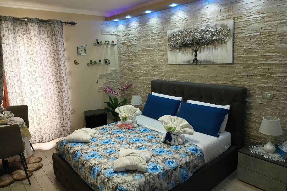 Premium bedding, down duvets, memory-foam beds, laptop workspace