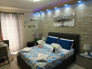 Premium bedding, down duvets, memory-foam beds, laptop workspace