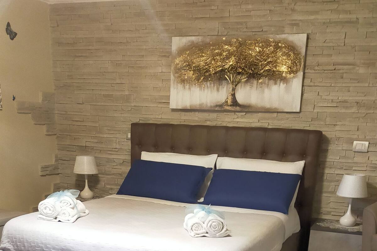 Premium bedding, down duvets, memory-foam beds, laptop workspace