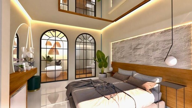 A modern bedroom with a large bed, a bedside table, a mirror, and a window with a view. - On Oda Oludeniz (Fethiye)