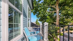 A covered outdoor area with a pool table, chairs, and a tree. - 15% OFF Monthly | 10% OFF Weekly- Chic Urban Retreat w Pool Steps to St. Charles Ave and (New Orleans)