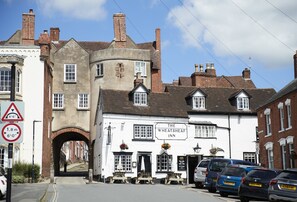 A traditional white building with a sign reading "The Wheatsheaf Inn." - The Stone Barn, Downton-on-the-Rock, Ludlow, Shropshire (Downton-on-the-Rock)