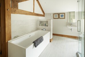 Bathtub, hair dryer, towels