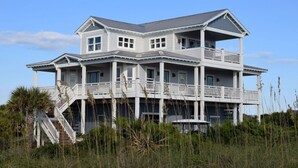 A large, two-story beachfront house with multiple balconies and a covered porch. - Ocean View - Family Friendly - Steps to Beach (Bald Head Island)