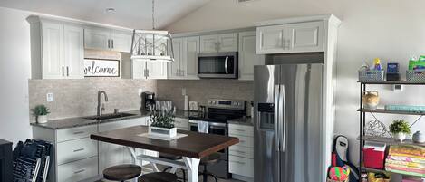 Coffee/tea maker, fridge, microwave, oven