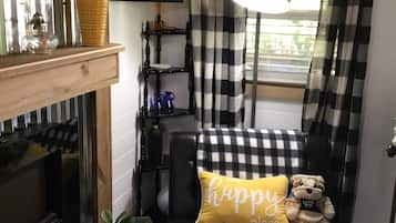 Smart TV, fireplace, books
