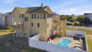 A two-story house with a deck, a swimming pool, and a gazebo. - 1509 - Sandpiper - OBX Corolla Beach House w/ Pool & Hot Tub (Corolla)