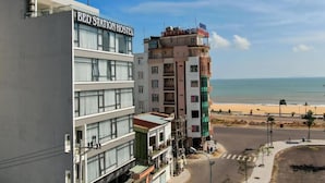 A hotel named 'BED STATION HOSTEL' with a view of the beach. - Bed Station Hostel (Quy Nhon)