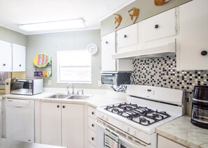 Oven, stovetop, coffee/tea maker, cookware/dishes/utensils
