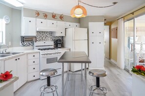 Oven, stovetop, coffee/tea maker, cookware/dishes/utensils